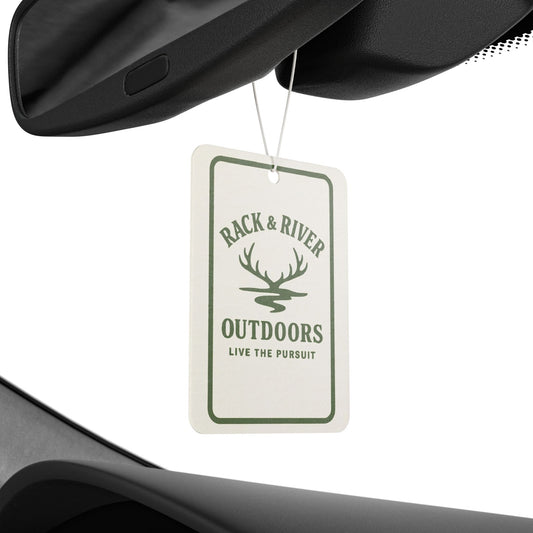 Rack & River Outdoors car air freshener hanging from a rear-view mirror, featuring antler logo and ‘Live The Pursuit’ design.