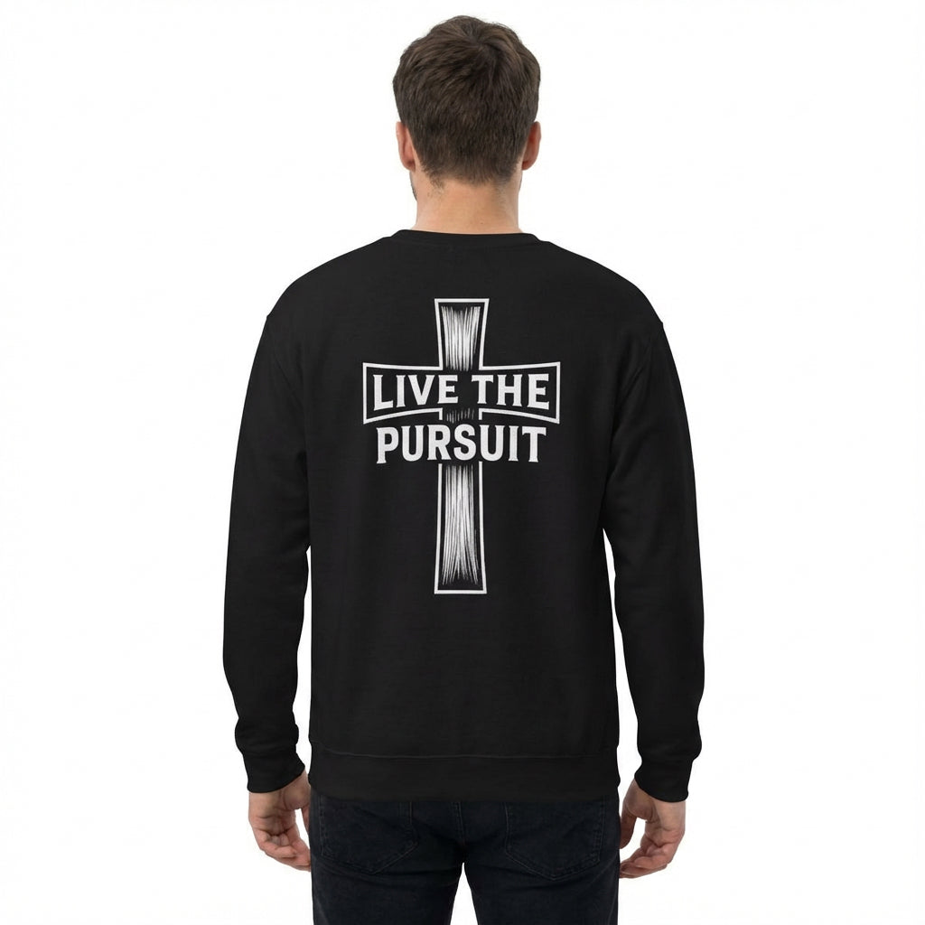 Person wearing black ‘Live The Pursuit’ cross crewneck from Rack & River Outdoors, back view.