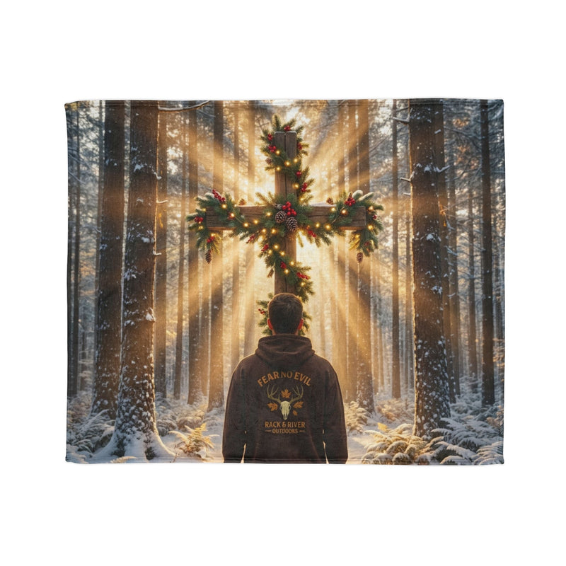 Faith-inspired forest artwork featuring a person in winter woods facing a radiant pine-tree cross.
