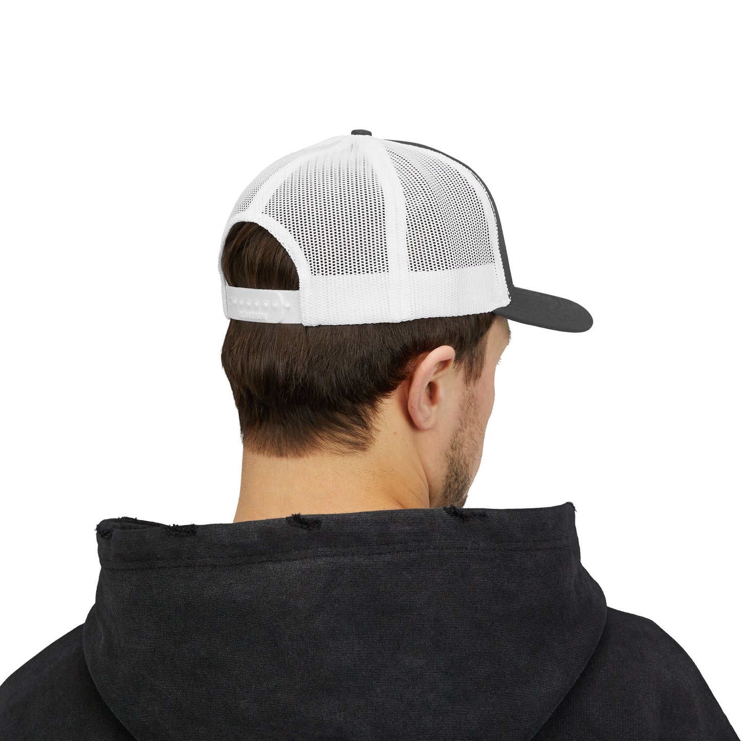 Back view of gray and white Rack & River Outdoors mesh trucker cap on model in black hoodie.