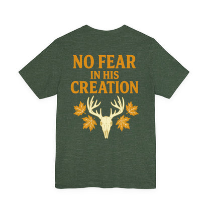 Green ‘No Fear in His Creation’ Christian hunting t-shirt with yellow deer antler skull design, product mockup on white background.