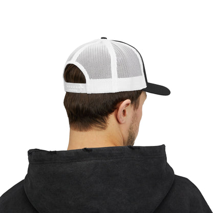 Back view of black and white Rack & River Outdoors mesh trucker cap on model in black hoodie.