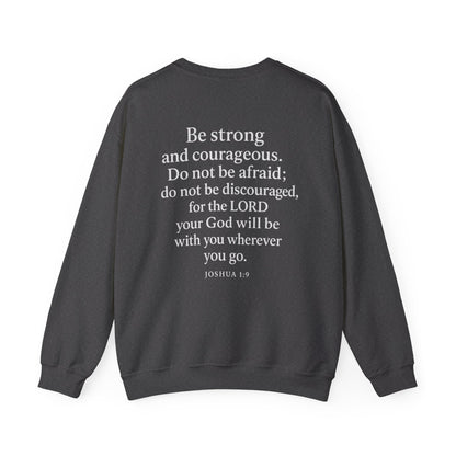 Dark gray Christian crewneck with Joshua 1:9 Bible verse printed on the back by Rack & River Outdoors.