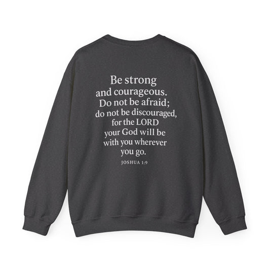 Dark gray Christian crewneck with Joshua 1:9 Bible verse printed on the back by Rack & River Outdoors.