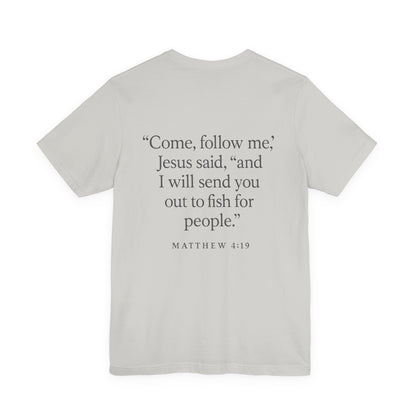 Gray color Christian t-shirt with Matthew 4:19 ‘Come, follow me… I will send you out to fish for people’ back design by Rack & River Outdoors.