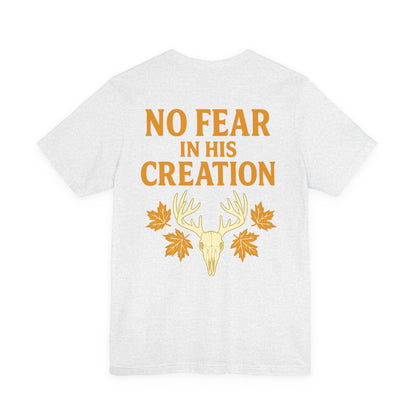 White ‘No Fear in His Creation’ Christian hunting t-shirt with yellow deer antler skull design, product mockup on white background.