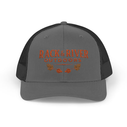 Christian outdoor trucker hat in gray and black with embroidered Rack & River Outdoors logo.”
“Rack & River Outdoors brown trucker cap with orange embroidered outdoor lifestyle logo.