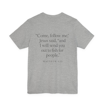 Gray color Christian t-shirt with Matthew 4:19 ‘Come, follow me… I will send you out to fish for people’ back design by Rack & River Outdoors.