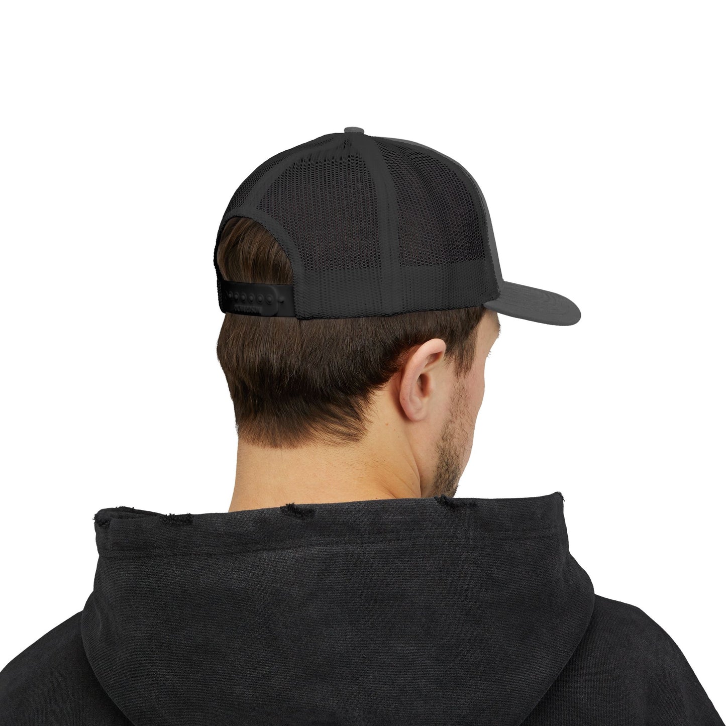 Back view of gray and black Rack & River Outdoors mesh trucker cap on model in black hoodie.