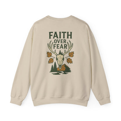 Tan Christian crewneck with ‘Faith Over Fear’ deer skull and fall leaves graphic, faith-based outdoor sweatshirt.
