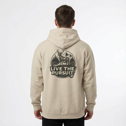 Model wearing Rack & River Outdoors hoodie showcasing Live The Pursuit circular back graphic.