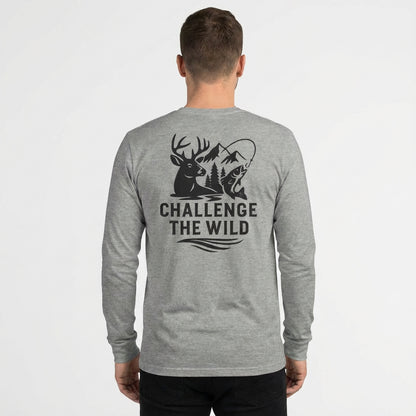 Back view of model wearing grey long sleeve shirt with large “Challenge the Wild” graphic.
